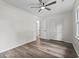 Bedroom with wood floors, closet space, neutral paint, and entrance to the bathroom at 203 Deer Trace, Myrtle Beach, SC 29588