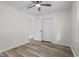 Bedroom with a ceiling fan, closet, door to hallway and light wood-look floors at 203 Deer Trace, Myrtle Beach, SC 29588