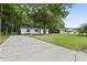Spacious driveway and beautifully maintained lawn showcasing the home's curb appeal at 203 Deer Trace, Myrtle Beach, SC 29588
