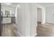 View of the kitchen and living spaces with stainless steel appliances and durable wood floors at 203 Deer Trace, Myrtle Beach, SC 29588