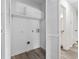 Laundry room featuring washer/dryer hookups, white shelving and access to bathroom at 203 Deer Trace, Myrtle Beach, SC 29588