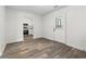 This is a view of the entryway to this home with views of the kitchen and durable wood floors at 203 Deer Trace, Myrtle Beach, SC 29588