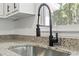 Kitchen with a stainless steel sink, a black faucet, and granite countertops at 203 Deer Trace, Myrtle Beach, SC 29588