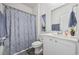 Bathroom with shower, vanity, decorative mirror and modern gray and white color palette at 205 Longside Ct., Little River, SC 29566