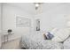 Cozy bedroom featuring a queen bed, ceiling fan, and modern coastal decor at 205 Longside Ct., Little River, SC 29566