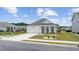 Charming single-story home featuring a well-manicured lawn, and a two-car garage at 205 Longside Ct., Little River, SC 29566