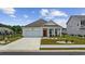 Inviting single-Gathering home with a well-kept lawn, featuring a two-car garage at 205 Longside Ct., Little River, SC 29566