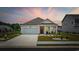 Charming single-story home featuring a well-manicured lawn, inviting porch, and attached garage at 205 Longside Ct., Little River, SC 29566