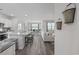 Open-concept kitchen with granite countertops, stainless steel appliances, and bar seating at 205 Longside Ct., Little River, SC 29566