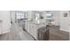 Spacious kitchen island with bar stools offering views into the living and dining area at 205 Longside Ct., Little River, SC 29566