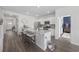 Open-concept kitchen featuring a large island, stainless steel appliances and pendant lighting at 205 Longside Ct., Little River, SC 29566