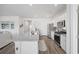 Bright kitchen with stainless steel appliances, kitchen island, and ample cabinet space at 205 Longside Ct., Little River, SC 29566