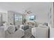 Bright living room featuring a shiplap wall, plush seating, and stylish decor for a welcoming ambiance at 205 Longside Ct., Little River, SC 29566