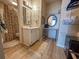 Well-lit bathroom featuring a vanity with a sink, decorative mirror, and a shower with a floral patterned curtain at 2101 S Ocean Blvd. # A-4, North Myrtle Beach, SC 29582