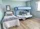 Cozy bedroom featuring a twin bed and bunk bed, perfect for Gathering or guests at 2101 S Ocean Blvd. # A-4, North Myrtle Beach, SC 29582