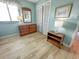 Bedroom with a dresser, mirror, lamps, and a closet with light colored wooden floors at 2101 S Ocean Blvd. # A-4, North Myrtle Beach, SC 29582