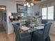 Dining area with seating for four and view into the kitchen at 2101 S Ocean Blvd. # A-4, North Myrtle Beach, SC 29582