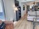 Comfortable living room with a cozy armchair, a TV, and views of the kitchen at 2101 S Ocean Blvd. # A-4, North Myrtle Beach, SC 29582