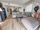 Spacious living room with a large sectional sofa, tasteful decor, and access to the kitchen at 2101 S Ocean Blvd. # A-4, North Myrtle Beach, SC 29582
