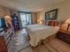 Bedroom with a king bed, dresser and sliding door to the balcony at 2101 S Ocean Blvd. # A-4, North Myrtle Beach, SC 29582