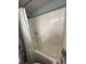 Clean shower with bright lighting and a white shower curtain, ready for relaxation and cleanliness at 2101 S Ocean Blvd. # A-4, North Myrtle Beach, SC 29582