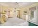 Comfortable bedroom with neutral walls, white furniture, and access to the ensuite bathroom at 213 Westleton Dr. # 16B, Myrtle Beach, SC 29572