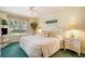 Cozy bedroom featuring a queen bed, ceiling fan, and natural light from the window at 213 Westleton Dr. # 16B, Myrtle Beach, SC 29572