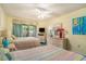 Comfortable guest bedroom with two beds, light colored walls, and access to the patio at 213 Westleton Dr. # 16B, Myrtle Beach, SC 29572