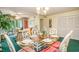 Spacious dining area featuring a glass table with seating for six, adjacent to the living room at 213 Westleton Dr. # 16B, Myrtle Beach, SC 29572