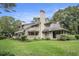 Exterior view of the townhouse highlighting the lush greenery, well-manicured lawn, and exterior finishes at 213 Westleton Dr. # 16B, Myrtle Beach, SC 29572