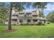 Exterior of a townhome showcasing multiple decks and balconies, and a large green lawn at 213 Westleton Dr. # 16B, Myrtle Beach, SC 29572