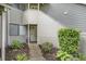 Charming townhouse exterior with a private entrance, lush landscaping, and a stone pathway leading to the front door at 213 Westleton Dr. # 16B, Myrtle Beach, SC 29572
