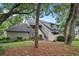 Beautiful exterior view of a multi-level townhome surrounded by mature trees, a well-manicured lawn, and lush landscaping at 213 Westleton Dr. # 16B, Myrtle Beach, SC 29572