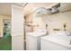 Functional laundry area with washer, dryer, storage shelves, and laundry accessories at 213 Westleton Dr. # 16B, Myrtle Beach, SC 29572