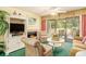 Cozy living room with a fireplace, comfortable seating, and a sliding door to the deck at 213 Westleton Dr. # 16B, Myrtle Beach, SC 29572