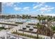 Expansive outdoor pool area with lounge chairs, white umbrellas, beach access and ocean views at 213 Westleton Dr. # 16B, Myrtle Beach, SC 29572