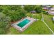 Aerial view showcasing the community pool area with lounge chairs surrounded by green grass at 218 Waccamaw Village Dr. # 218, Myrtle Beach, SC 29579