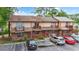 Charming townhome complex featuring brick and siding exteriors, small balconies, and well-maintained parking areas at 218 Waccamaw Village Dr. # 218, Myrtle Beach, SC 29579