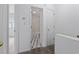 Hallway view of a bathroom with checkered floors and white fixtures at 218 Waccamaw Village Dr. # 218, Myrtle Beach, SC 29579