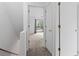 Hallway leading to a carpeted room with natural light from a sliding glass door at 218 Waccamaw Village Dr. # 218, Myrtle Beach, SC 29579