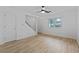 Bright living room featuring wood-look floors, a ceiling fan, and staircase access to upper level at 218 Waccamaw Village Dr. # 218, Myrtle Beach, SC 29579