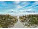 Picturesque path through dunes leading to the beach, offering a serene and natural setting at 2180 Waterview Dr. # 635, North Myrtle Beach, SC 29582