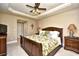 Comfortable bedroom with wood furniture, ceiling fan, and a scenic view at 2180 Waterview Dr. # 635, North Myrtle Beach, SC 29582