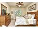 Well-furnished bedroom with wooden furniture, ceiling fan, and a window view at 2180 Waterview Dr. # 635, North Myrtle Beach, SC 29582