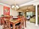 Open-concept dining and living room with natural light, modern furnishings, and a chandelier at 2180 Waterview Dr. # 635, North Myrtle Beach, SC 29582