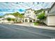 Inviting building entrance features manicured landscaping, sidewalks, and palm trees against a cloudy sky at 2180 Waterview Dr. # 635, North Myrtle Beach, SC 29582