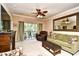 Comfortable living room features a ceiling fan, sliding glass doors to a balcony, and relaxing furnishings at 2180 Waterview Dr. # 635, North Myrtle Beach, SC 29582