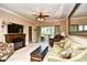 Inviting living room with a fireplace, TV, sliding glass doors to a balcony, and comfortable seating at 2180 Waterview Dr. # 635, North Myrtle Beach, SC 29582