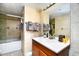 Bright bathroom features tiled walls, a vanity, and a shower with a bathtub at 2310 N Ocean Blvd. # 1107, Myrtle Beach, SC 29577