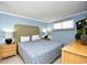 Cozy bedroom with blue walls, bedside lamps, and natural light at 2310 N Ocean Blvd. # 1107, Myrtle Beach, SC 29577